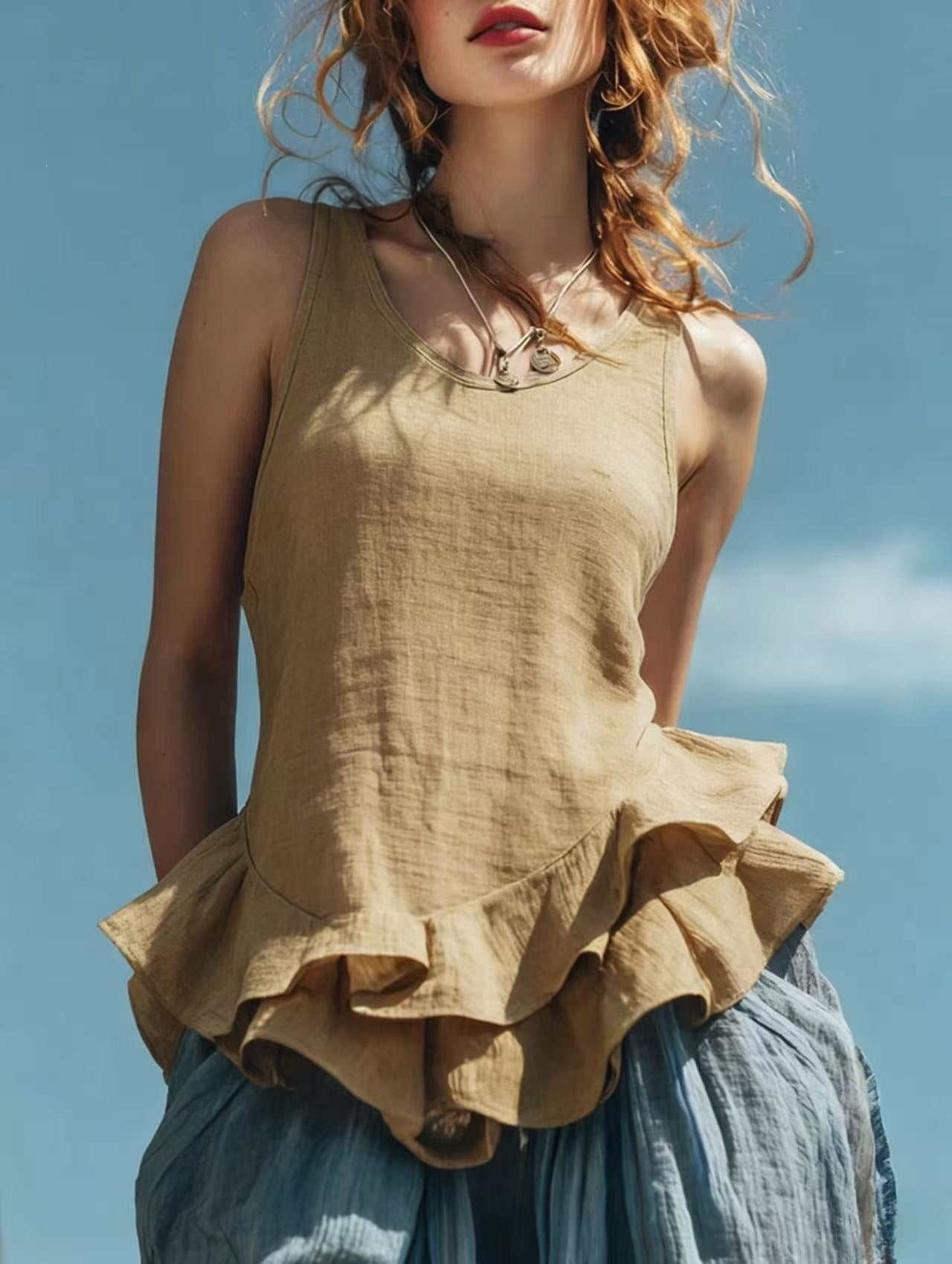 Sleeveless women's top with ruffled hem